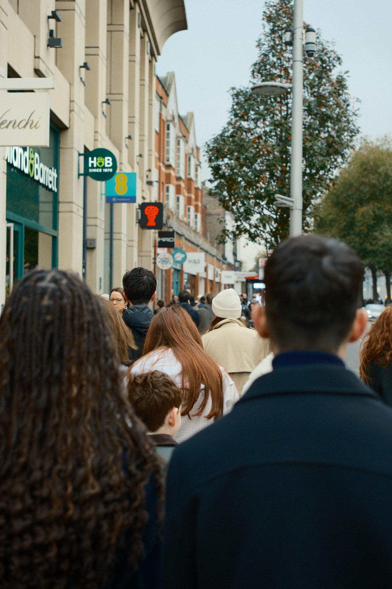 People walking up and down a street in Chelsea, London