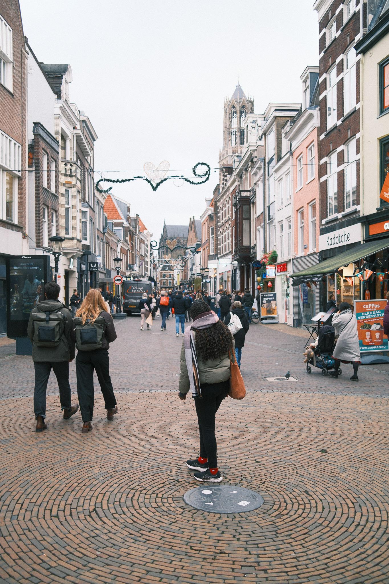 people walking by a street in Utrecht